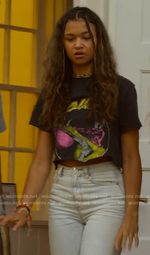 Kiara's cropped Bowie tee and ripped jeans on Outer Banks