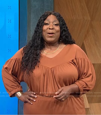 Loni’s brown gathered jumpsuit on E! News Daily Pop