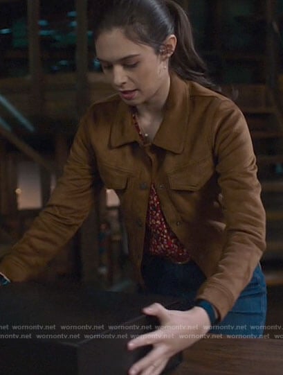 Nia's suede jacket and red floral top on Supergirl