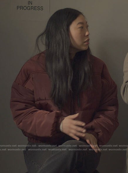 Nora’s red puffer jacket with corduroy panels on Awkwafina is Nora From Queens