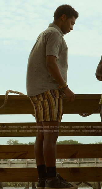 Pope's s grey printed shirt and striped shorts on Outer Banks