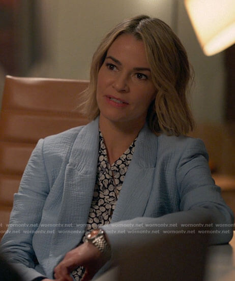 Alice's light blue blazer and  orange print top and pants on The L Word Generation Q