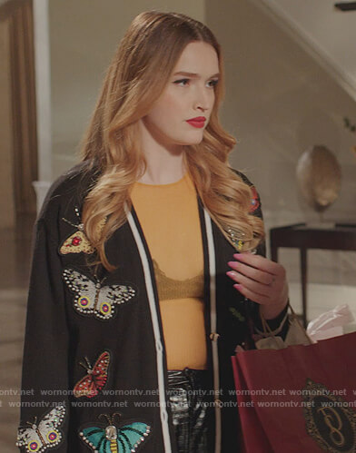 Kirby’s black butterfly embellished cardigan on Dynasty