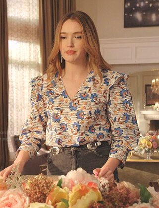 Kirby's white floral v-neck top and buckle denim skirt on Dynasty