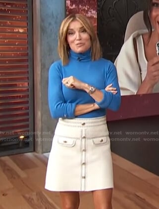 Kit’s white skirt with contrast stitching on Access Hollywood