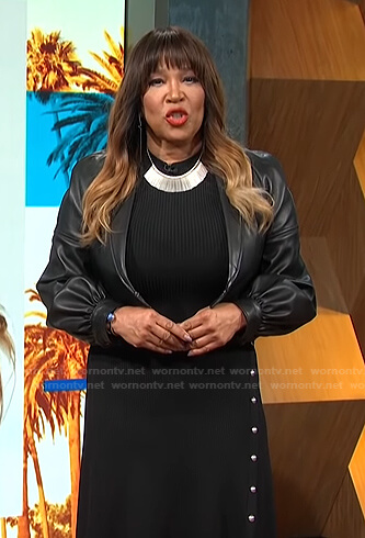 Kym’s black ribbed dress and cropped leather jacket on E! News Daily Pop