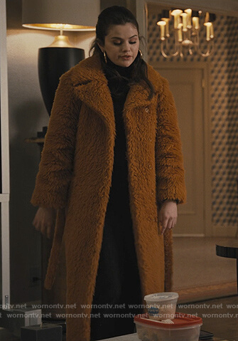 Mabel's fur coat and boots on Only Murders in the Building