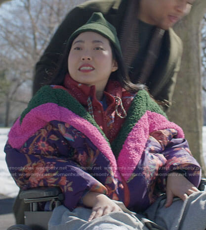 Nora’s purple floral puffer jacket with pink and green stripes on Awkwafina is Nora From Queens