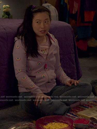 Young Nora's purple rainbow hoodie and flower top on Awkwafina is Nora From Queens