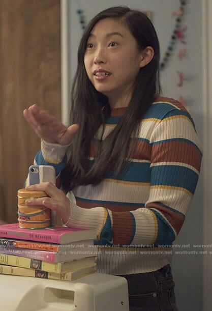 Nora's striped sweater on Awkwafina is Nora From Queens