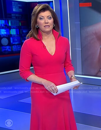 Norah’s pink stand collar v-neck dress on CBS Evening News