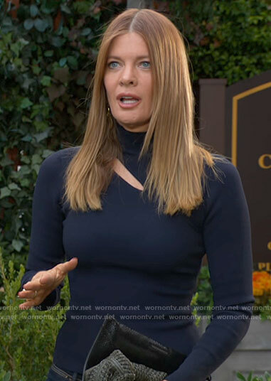 Phyllis’s navy blue turtleneck with cutout on The Young and the Restless