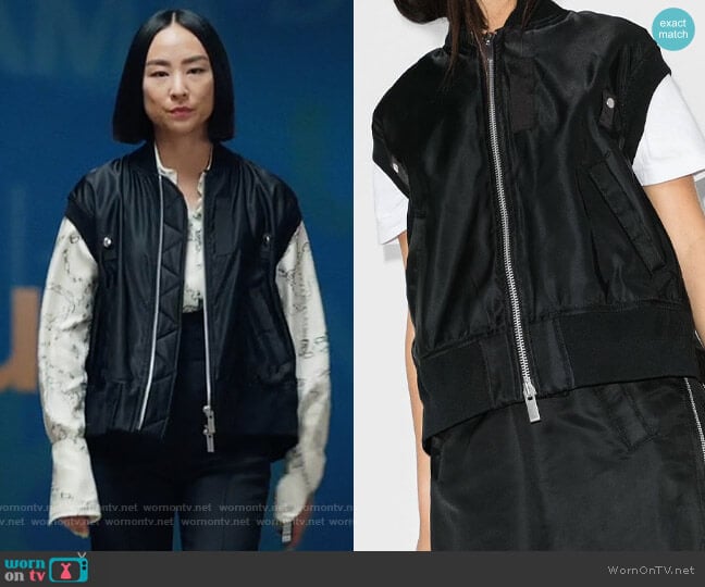 Sacai short-sleeve shell bomber jacket worn by Stella Bak (Greta Lee) on The Morning Show