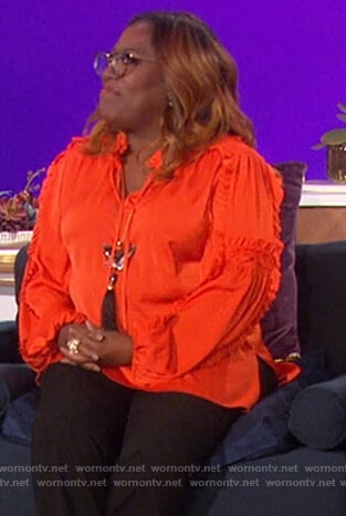 Sheryl’s orange ruffle blouse on The Talk