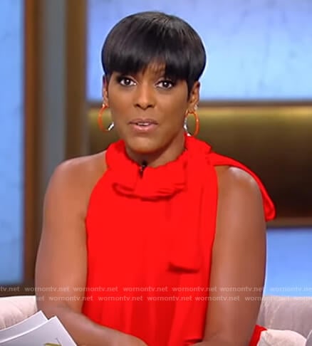 Tamron’s red tie neck top on Tamron Hall Show