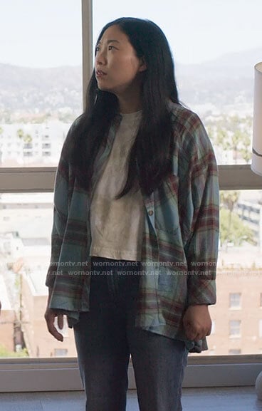 Nora's turquoise blue plaid shirt on Awkwafina is Nora From Queens