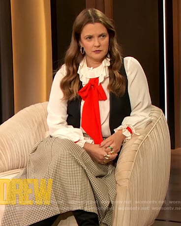 Drew’s white contrasting blouse and check skirt on The Drew Barrymore Show