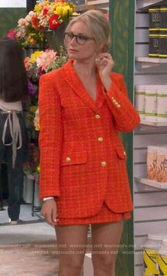 Gemma's orange tweed blazer and skirt set on The Neighborhood