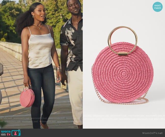 Round Straw Shoulder Bag by H&M worn by Angela Vaughn (Yaya DaCosta) on Our Kind of People