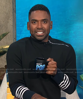 Justin’s black zip-shoulder sweater on E! News Daily Pop