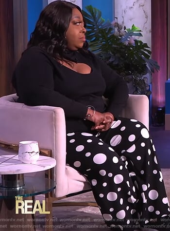 Loni’s black cutout sweater and printed pants on The Real