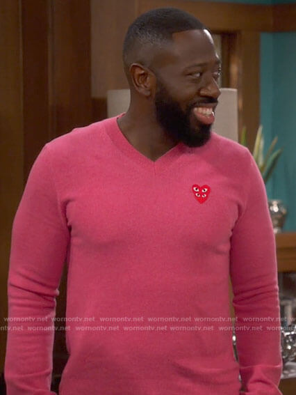 Malcolm's pink heart sweater on The Neighborhood