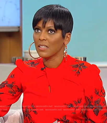 Tamron’s red floral twist neck blouse on Tamron Hall Show