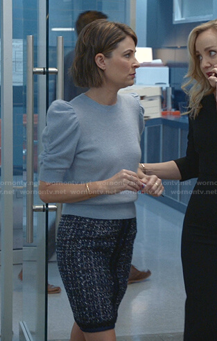 Taylor’s blue puff sleeve sweater and tweed skirt on Bull