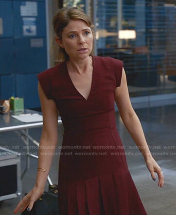 Taylor's burgundy pleated v-neck dress on Bull