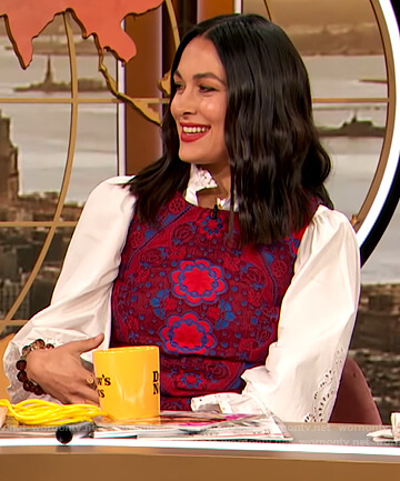 Brie Bella’s red floral dress and embroidered blouse on The Drew Barrymore Show