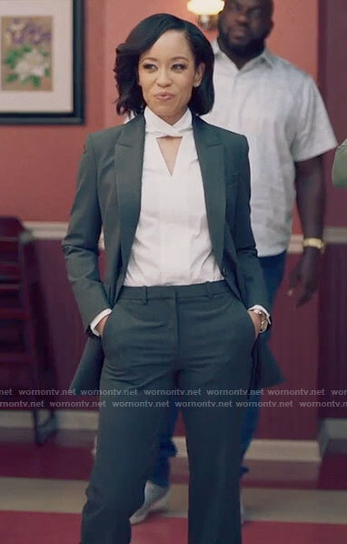 Charley's white keyhole blouse and grey suit on Queen Sugar