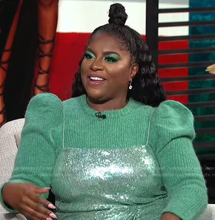 Ester Dean’s green puff sleeve sweater and sequin dress on E! News Daily Pop