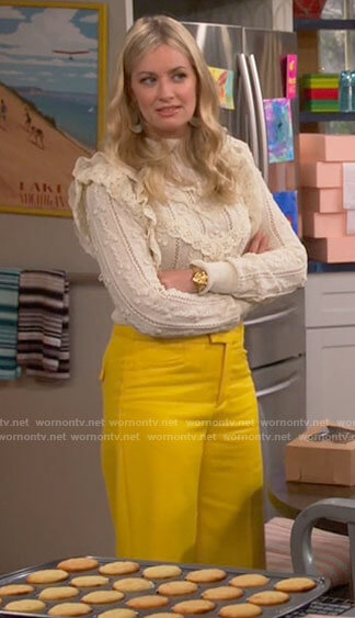 Gemma's ruffled sweater and yellow pants on The Neighborhood