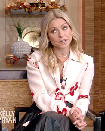 Kelly’s white floral blouse and black pleated skirt on Live with Kelly and Ryan