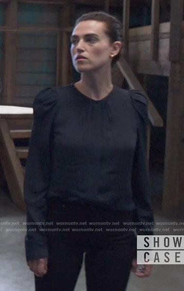 Lena's navy puff sleeve blouse on Supergirl