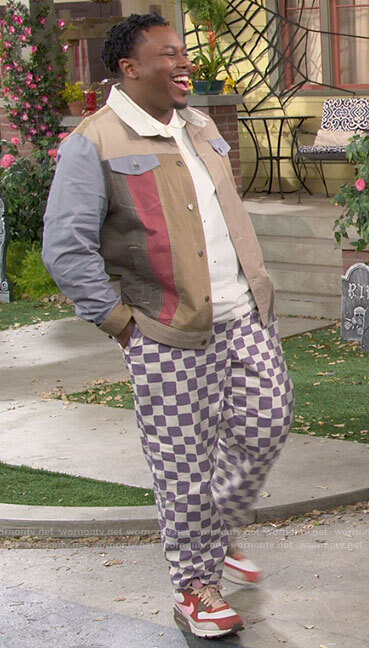 Marty's colorblock shirt and purple checkered pants on The Neighborhood