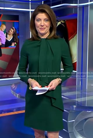 Norah’s green tie neck dress on CBS Evening News