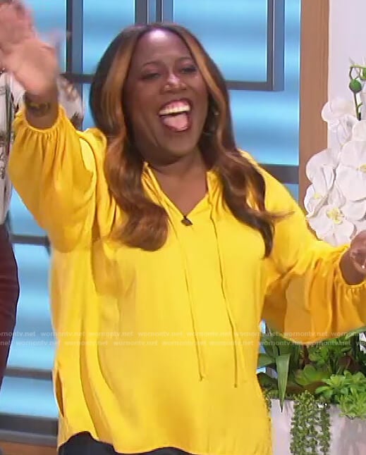 Sheryl’s yellow tie neck blouse on The Talk