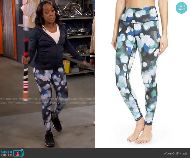 Zella Live In High Waist Ankle Performance Leggings in Black Teal Color Bursts worn by Tina (Tichina Arnold) on The Neighborhood
