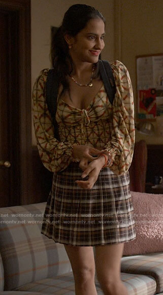Bela's tie dye smocked top and plaid skirt on The Sex Lives of College Girls