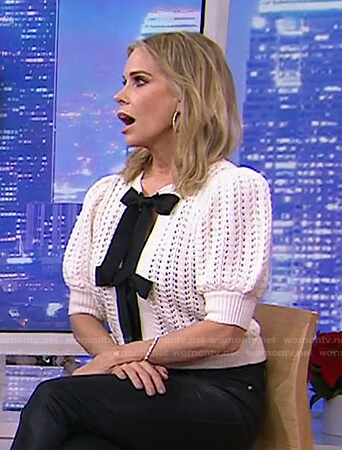 Cheryl Hines’s white open knit bow cardigan on Today