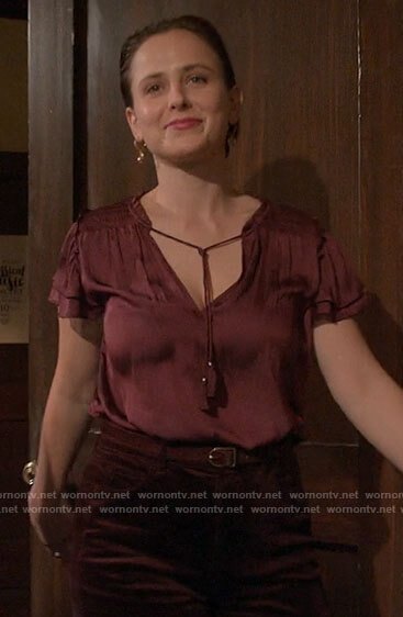 Kimberly's burgundy tassel tie satin top on The Sex Lives of College Girls