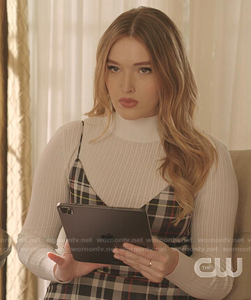 Kirby’s white pointelle sweater and plaid dress on Dynasty