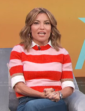 Kit’s pink, red and metallic striped sweater on Access Hollywood