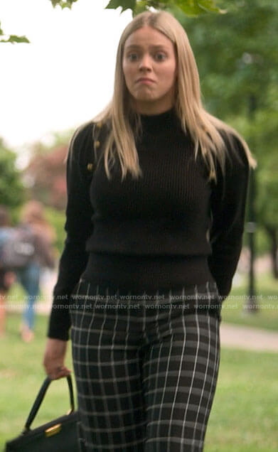Leighton's black button shoulder sweater and checked pants on The Sex Lives of College Girls