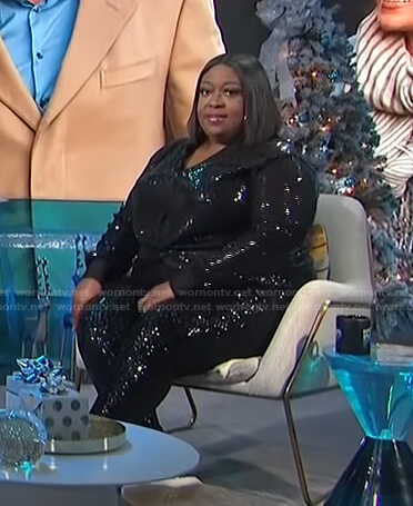 Loni's black sequin top and pants on E! News Daily Pop
