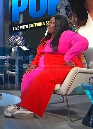Loni’s pink and red colorblock jumpsuit on E! News Daily Pop