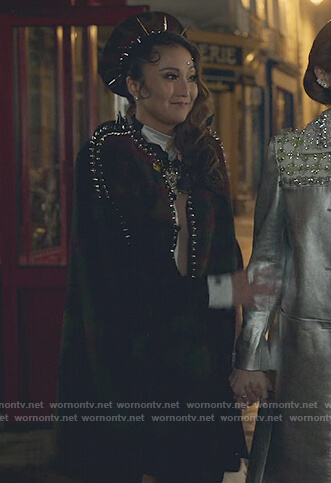 Mindy's plaid studded cape and beret on Emily in Paris
