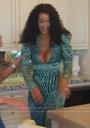 Noella’s green mixed print plunging dress on The Real Housewives of Orange County