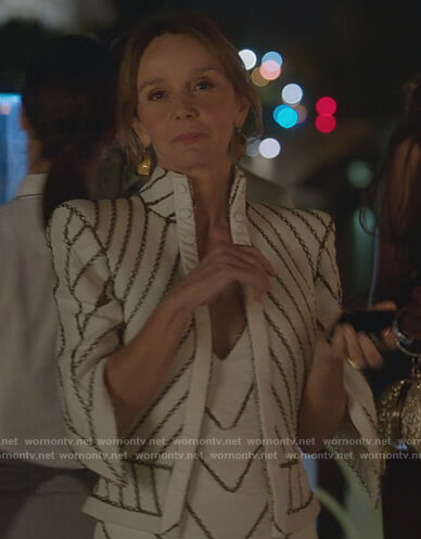Sylvie's white chain embellished jacket and dress on Emily in Paris